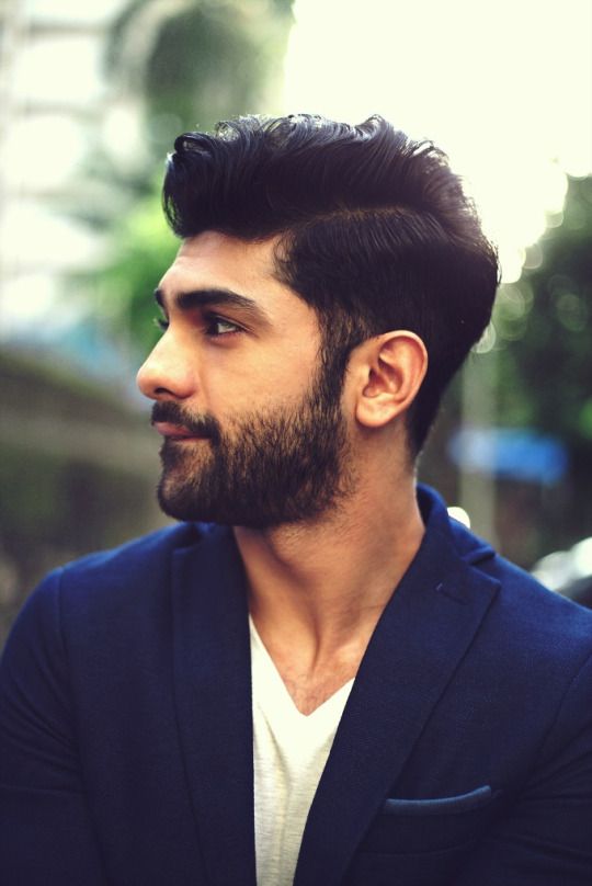 Taaha Shah, showing us the art of a good haircut and trimmed beard .